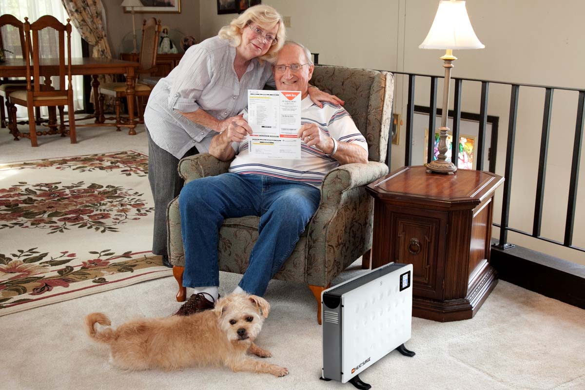 A couple showing off their bill savings with a Power Panel next to them